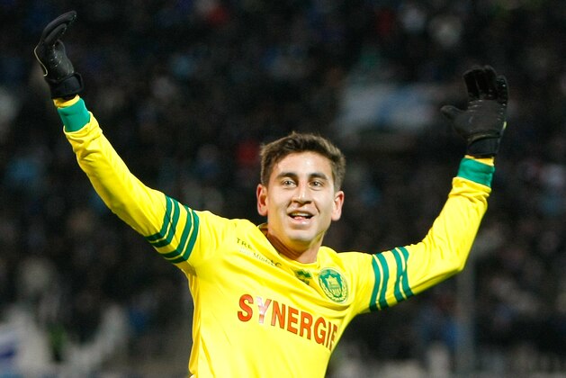 Nantes' American midfielder Alejandro Bedoya, celebrates after scoring against Marseille, during their League One soccer match, at the Velodrome Stadium, in Marseille, southern France, Friday, Dec. 6, 2013. (AP Photo/Claude Paris)