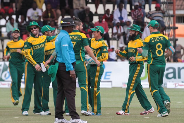 South African players celebrate the wicket of Zimbabwean batsman Sikandar Razar during the cricket One Day International in Harare Zimbabwe Thursday, Sept. 4, 2014.(AP Photo/Tsvangirayi Mukwazhi)
