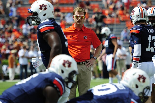 Aug 30, 2014; Auburn, AL, USA; Auburn Tigers offensive coordinator Rhett Lashlee  during warm-ups prior to the game against the Arkansas Razorbacks at Jordan Hare Stadium. Mandatory Credit: Shanna Lockwood-USA TODAY Sports