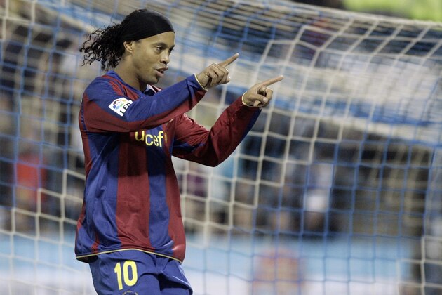 Barcelona's Ronaldinho reacts after scoring a goal against Zaragoza during their Spanish league soccer match at the La Romareda stadium in Zaragoza, Spain, Saturday, Feb. 16, 2008. (AP Photo/Manu Fernandez)