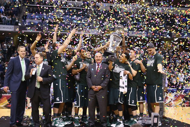 INDIANAPOLIS, IN - MARCH 16:  The Michigan State Spartans celebrate after the 69-55 win over the Michigan Wolverines  during the finals of the Big Ten Basketball Tournament at Bankers Life Fieldhouse on March 16, 2014 in Indianapolis, Indiana.  (Photo by Andy Lyons/Getty Images)