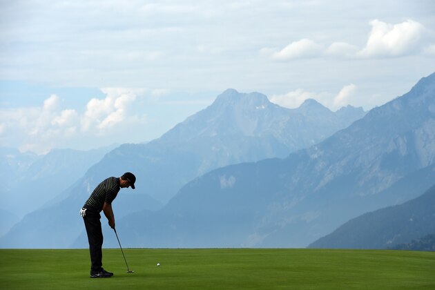 CRANS-MONTANA, SWITZERLAND - SEPTEMBER 04:  Ross Fisher of England putts during the first round of the Omega European Masters at Crans-sur-Sierre Golf Club on September 4, 2014 in Crans-Montana, Switzerland.  (Photo by Stuart Franklin/Getty Images)