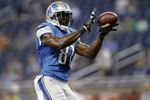 Detroit Lions wide receiver Calvin Johnson (81) catches a ball during warmups for a NFL football game against the Jacksonville Jaguars in Detroit, Friday, Aug. 22, 2014.  (AP Photo/Paul Sancya)