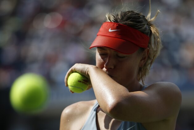 Maria Sharapova, of Russia, prepares to serve against Caroline Wozniacki, of Denmark, during the fourth round of the 2014 U.S. Open tennis tournament, Sunday, Aug. 31, 2014, in New York. (AP Photo/Kathy Willens)