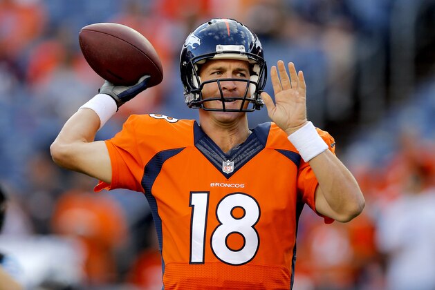 Denver Broncos quarterback Peyton Manning (18) warms up prior to an NFL preseason football game against the Houston Texans, Saturday, Aug. 23, 2014, in Denver. (AP Photo/Jack Dempsey)