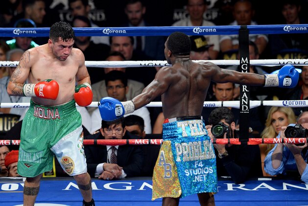 LAS VEGAS, NV - MAY 03:  (L-R) Carlos Molina looks at Adrien Broner as he sticks his arms out during their super lightweight bout at the MGM Grand Garden Arena on May 3, 2014 in Las Vegas, Nevada.  (Photo by Ethan Miller/Getty Images)