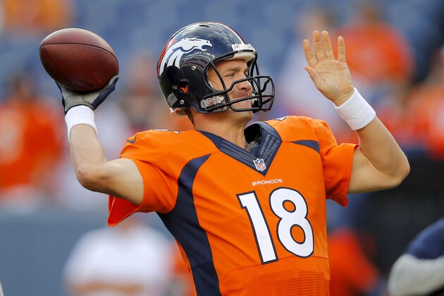 Denver Broncos quarterback Peyton Manning (18) warms up prior to an NFL preseason football game against the Houston Texans, Saturday, Aug. 23, 2014, in Denver. (AP Photo/Jack Dempsey)
