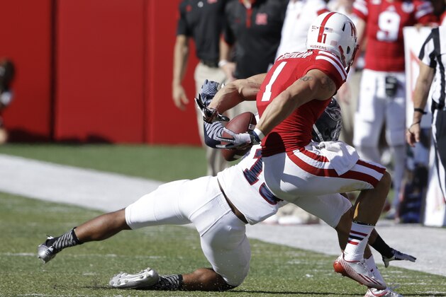 Nebraska wide receiver Jordan Westerkamp (1) makes a catch behind his back against Florida Atlantic defensive back Christian Milstead (18) from a throw by Nebraska quarterback Tommy Armstrong Jr., in the second half of an NCAA college football game in Lincoln, Neb., Saturday, Aug. 30, 2014. (AP Photo/Nati Harnik)