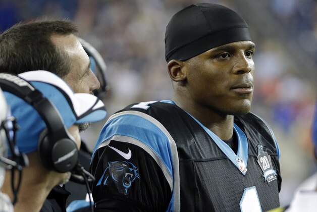 Carolina Panthers quarterback Cam Newton watches action from the sideline in the first half of an NFL preseason football game against the New England Patriots Friday, Aug. 22, 2014, in Foxborough, Mass. (AP Photo/Stephan Savoia)