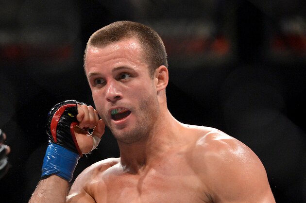 Nov 2, 2013; Long Beach, CA, USA;   Pat Curran (blue gloves) during the Bellator Featherweight World Championship fight against Daniel Straus (not shown) at the Long Beach Arena. Daniel Straus won by decision. Mandatory Credit: Jayne Kamin-Oncea-USA TODAY Sports