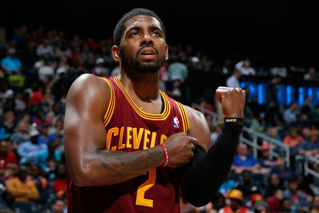 ATLANTA, GA - APRIL 04:  Kyrie Irving #2 of the Cleveland Cavaliers grabs his arm after falling out of bounds with the ball against the Atlanta Hawks at Philips Arena on April 4, 2014 in Atlanta, Georgia.  NOTE TO USER: User expressly acknowledges and agrees that, by downloading and or using this photograph, User is consenting to the terms and conditions of the Getty Images License Agreement.  (Photo by Kevin C. Cox/Getty Images)