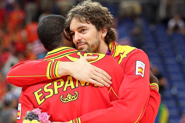 LONDON, ENGLAND - AUGUST 12:  Silver medallist Pau Gasol #4 of Spain hugs team mate Serge Ibaka #14 of Spain following the medal ceremony for the Men's Basketball on Day 16 of the London 2012 Olympics Games at North Greenwich Arena on August 12, 2012 in London, England.  (Photo by Christian Petersen/Getty Images)