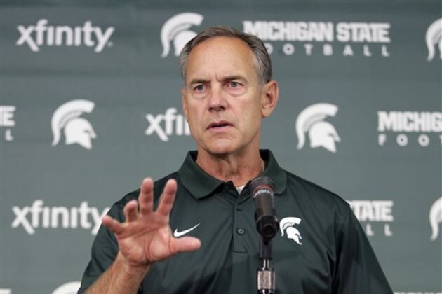 FILE - In this Aug. 4, 2014, file photo, Michigan State coach Mark Dantonio addresses the media during the team's NCAA college football media day in East Lansing, Mich. The Spartans haven't always handled high expectations well, and that's something that needs to change for coach  Dantonio. (AP Photo/Al Goldis, File)