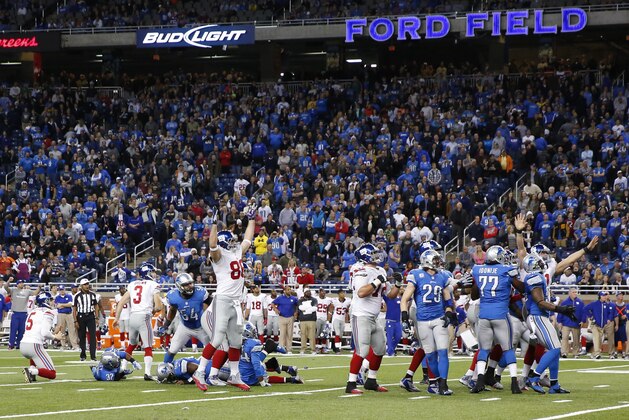 New York Giants kicker Josh Brown (3) kicks a game winning field goal against the Detroit Lions in overtime of an NFL football game at Ford Field in Detroit, Sunday, Dec. 22, 2013. (AP Photo/Rick Osentoski)