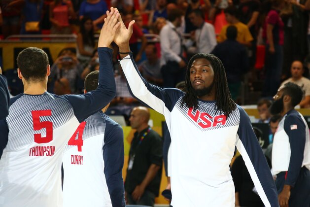 BILBAO, SPAIN - SEPTEMBER 4:  Teammates Klay Thompson #5 and Kenneth Faried #7 of the USA Basketball Men's National Team high-five prior to playing a game against the Ukraine Basketball Men's National Team during the 2014 FIBA World Cup at Bizkaia Arena in Bilbao Exhibition Centre on September 4, 2014 in Bilbao, Spain.  NOTE TO USER: User expressly acknowledges and agrees that, by downloading and/or using this Photograph, user is consenting to the terms and conditions of the Getty Images License Agreement. Mandatory Copyright Notice: Copyright 2014 NBAE (Photo by Nathaniel S. Butler/NBAE via Getty Images)
