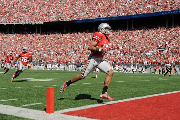 COLUMBUS, OH - SEPTEMBER 15:  Devin Smith #15 of the Ohio State Buckeyes crosses the goal line to complete a 72-yard touchdown reception against the California Golden Bears in the fourth quarter at Ohio Stadium on September 15, 2012 in Columbus, Ohio. The touchdown would prove to be the game winner as the Buckeyes topped the Golden Bears 35-28.  (Photo by Jamie Sabau/Getty Images)