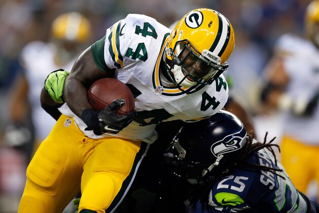 SEATTLE, WA - SEPTEMBER 04: Running back James Starks #44 of the Green Bay Packers is hit by cornerback Richard Sherman #25 of the Seattle Seahawks during the third quarter of the game at CenturyLink Field on September 4, 2014 in Seattle, Washington.  (Photo by Otto Greule Jr/Getty Images)