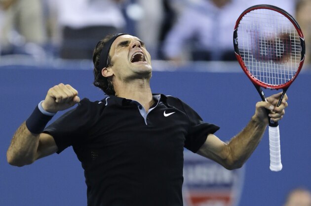 Roger Federer, of Switzerland, celebrates his win over Gael Monfils, of France, during the quarterfinal round of the 2014 U.S. Open tennis tournament, Thursday, Sept. 4, 2014, in New York. Federer defeated Monfils 4-6, 3-6, 6-4, 7-5, 6-2. (AP Photo/Charles Krupa)