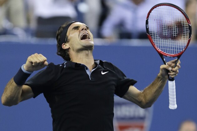 Roger Federer, of Switzerland, celebrates his win over Gael Monfils, of France, during the quarterfinal round of the 2014 U.S. Open tennis tournament, Thursday, Sept. 4, 2014, in New York. Federer defeated Monfils 4-6, 3-6, 6-4, 7-5, 6-2. (AP Photo/Charles Krupa)