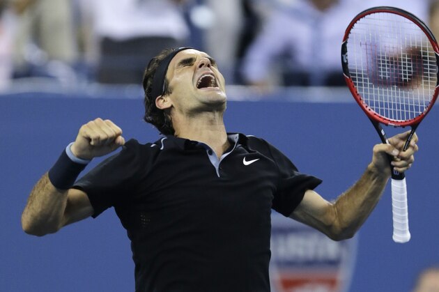 Roger Federer, of Switzerland, celebrates his win over Gael Monfils, of France, during the quarterfinal round of the 2014 U.S. Open tennis tournament, Thursday, Sept. 4, 2014, in New York. Federer defeated Monfils 4-6, 3-6, 6-4, 7-5, 6-2. (AP Photo/Charles Krupa)