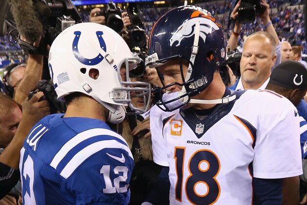 INDIANAPOLIS, IN - OCTOBER 20:  Andrew Luck #12 of the Indianapolis Colts and Peyton Manning #18 of the Denver Broncos meet after the game at Lucas Oil Stadium on October 20, 2013 in Indianapolis, Indiana. The Colts won 39-33.  (Photo by Andy Lyons/Getty Images)