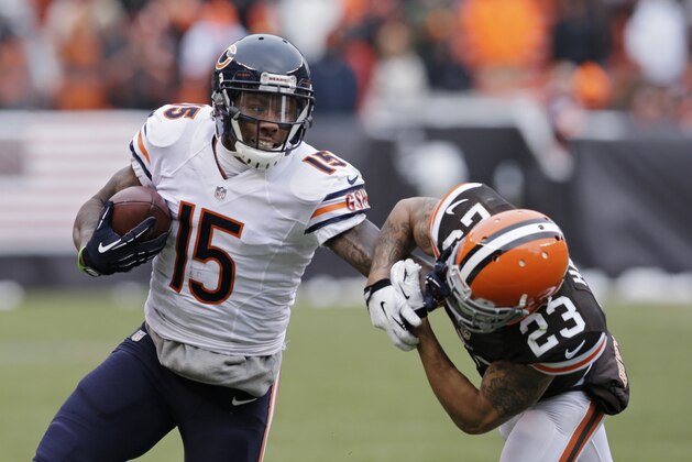 FILE - In this Dec. 15, 2013 file photo, Chicago Bears wide receiver Brandon Marshall (15) pushes Cleveland Browns cornerback Joe Haden (23) away after a catch in the second quarter of an NFL football game, in Cleveland. The Bears have agreed to terms with Pro Bowl wide receiver Brandon Marshall on a three-year contract extension. It is worth a reported $30 million, and Marshall's foundation tweeted Monday, May 19, 2014, that he was donating $1 million to the FILE - In this Dec. 15, 2013 file photo, Chicago Bears wide receiver Brandon Marshall (15) pushes Cleveland Browns cornerback Joe Haden (23) away after a catch in the second quarter of an NFL football game, in Cleveland. The Bears have agreed to terms with Pro Bowl wide receiver Brandon Marshall on a three-year contract extension. It is worth a reported $30 million, and Marshall's foundation tweeted Monday, May 19, 2014, that he was donating $1 million to the