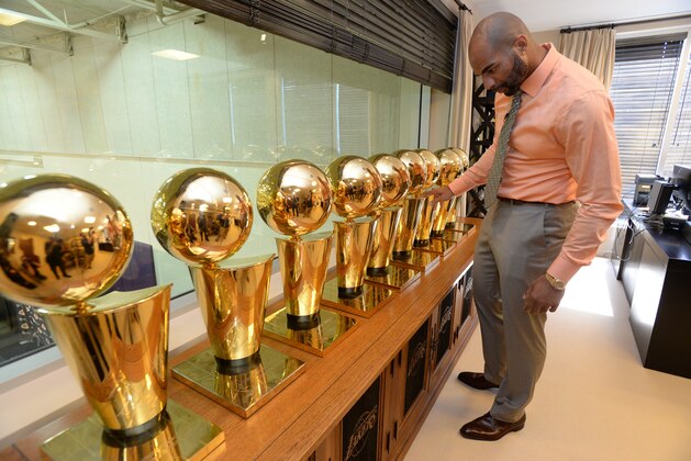 EL SEGUNDO, CA - JULY 25: Carlos Boozer #5 of the Los Angeles Lakers looks at the Los Angeles Lakers championship trophies in the office of Jeanie Buss before a press conference at the Toyota Sports Center on July 25, 2014 in El Segundo, California. NOTE TO USER: User expressly acknowledges and agrees that, by downloading and/or using this photograph, user is consenting to the terms and conditions of the Getty Images License Agreement.  Mandatory Copyright Notice: Copyright 2014 NBAE (Photo by Andrew D. Bernstein/NBAE via Getty Images)