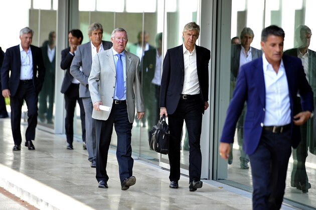 NYON, SWITZERLAND - SEPTEMBER 03:  UEFA Elite Club Coaches Forum Chairman Sir Alex Ferguson and Arsenal FC Coach Arsene Wenger arrive for the UEFA Elite Club Coaches Forum at the UEFA headquarters, The House of European Football, on Spetember 3, 2014 in Nyon, Switzerland.  (Photo by Harold Cunningham/Getty Images for UEFA)