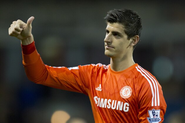 Chelsea's goalkeeper Thibaut Courtois gestures as he walks from the pitch after his team's 3-1 win at Burnley in their English Premier League soccer match at Turf Moor Stadium, Burnley, England, Monday Aug. 18, 2014. (AP Photo/Jon Super)