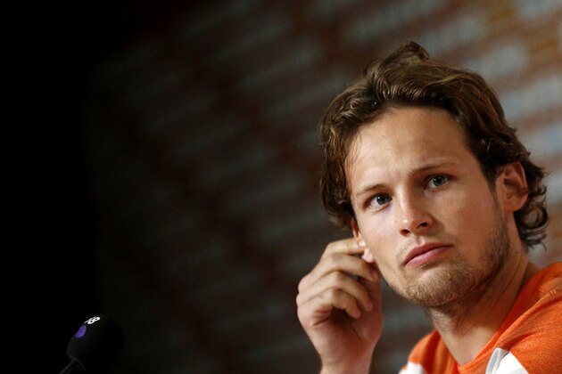 Daley Blind of the Netherlands listens to his team mate speak during a press conference after a training session in Rio de Janeiro, Brazil, Sunday, June 15, 2014. His commanding play in that match has sparked intense speculation in England that he could be playing in the red of Manchester United next season when current Netherlands coach Louis van Gaal moves to Old Trafford and attempts to rebuild the storied club after a disastrous season. (AP Photo/Wong Maye-E)