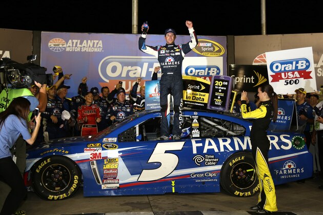 HAMPTON, GA - AUGUST 31:  Kasey Kahne, driver of the #5 Farmers Insurance Chevrolet, celebrates in Victory Lane after winning the NASCAR Sprint Cup Series Oral-B USA 500 at Atlanta Motor Speedway on August 31, 2014 in Hampton, Georgia.  (Photo by Jerry Markland/Getty Images)