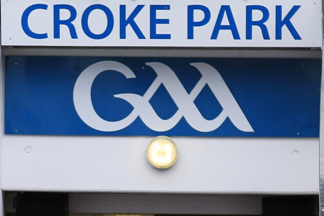 Britain's Queen Elizabeth II, centre, Irish President Mary Mc Aleese, left and  Christy Cooney, President of the Gaelic Athletic Association look out at the pitch at the home of the GAA, Croke Park Stadium, in Dublin, Wednesday May 18, 2011, site of a notorious massacre where British troops killed 14 Irish civilians in 1920.  The Queen's visit to Croke Park on the second day of her historic trip to the Republic of Ireland highlights the vast improvement in Anglo-Irish relations since those dark days. It brought the English monarch to a large sports stadium that is a revered spot for Irish nationalists who mourn those who died there during the conflict with Britain.(AP Photo/Peter Morrison)