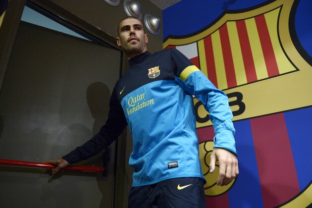 FC Barcelona's goalkeeper Victor Valdes leaves a press conference at the Camp Nou stadium in Barcelona, Spain, Friday, May 31, 2013. (AP Photo/Manu Fernandez)