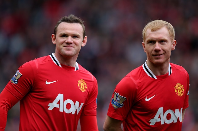 MANCHESTER, ENGLAND - APRIL 15:  Wayne Rooney  and Paul Scholes (R) of Manchester United look on prior to the Barclays Premier League match between Manchester United and Aston Villa at Old Trafford on April 15, 2012 in Manchester, England.  (Photo by Alex Livesey/Getty Images)