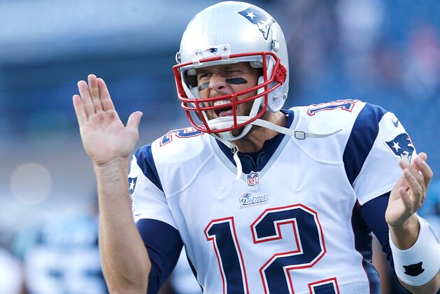 FOXBORO, MA - AUGUST 22:  Tom Brady #12 of the New England Patriots reacts before a game with the Carolina Panthers at Gillette Stadium on August 22, 2014 in Foxboro, Massachusetts. (Photo by Jim Rogash/Getty Images)