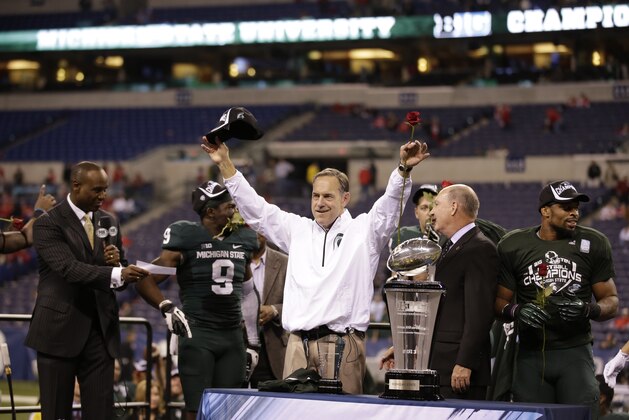 Michigan State head coach Mark Dantonio celebrates following Big Ten Conference championship NCAA college football game against Ohio State Sunday, Dec. 8, 2013, in Indianapolis. Michigan State defeated Ohio State 34-24. (AP Photo/AJ Mast)