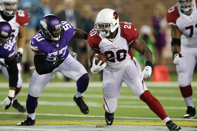 Arizona Cardinals running back Jonathan Dwyer (20) runs from Minnesota Vikings outside linebacker Gerald Hodges (50) during the first half of an NFL preseason football game, Saturday, Aug. 16, 2014, in Minneapolis. (AP Photo/Jim Mone)