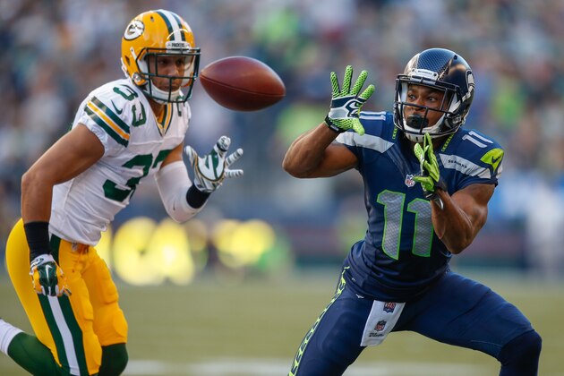 SEATTLE, WA - SEPTEMBER 04:  Wide receiver Percy Harvin #11 of the Seattle Seahawks makes a catch against free safety Micah Hyde #33 of the Green Bay Packers at CenturyLink Field on September 4, 2014 in Seattle, Washington. The Seahawks defeated the Packers 36-16.  (Photo by Otto Greule Jr/Getty Images)
