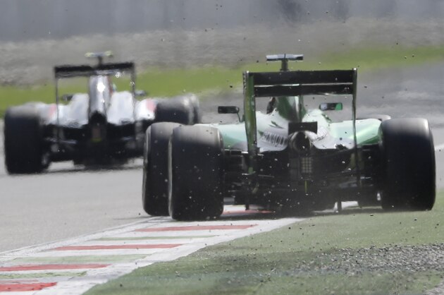 Caterham driver Kamui Kobayashi of Japan steers his car during the second free practice at the Monza racetrack, in Monza, Italy , Friday, Sept. 5 , 2014. The Formula one race will be held on Sunday. (AP Photo/Luca Bruno)