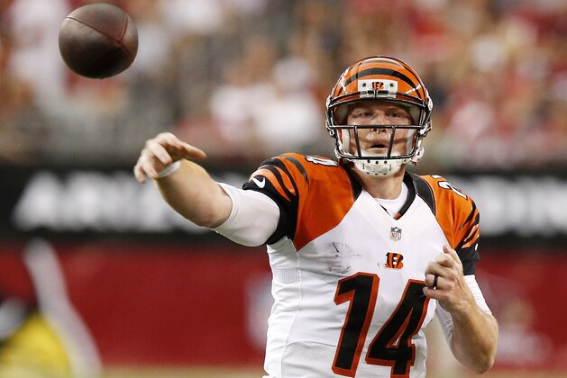Cincinnati Bengals' Andy Dalton gets off a pass against the Arizona Cardinals during the first half of an NFL preseason football game Sunday, Aug. 24, 2014, in Glendale, Ariz. (AP Photo/Ross D. Franklin)