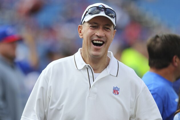 Former Buffalo Bills quarterback Jim Kelly smiles as he walks on the field before a preseason NFL football game between the Buffalo Bills and the Tampa Bay Buccaneers Saturday, Aug. 23, 2014, in Orchard Park, N.Y. (AP Photo/Bill Wippert)