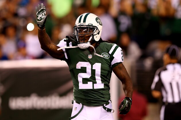 EAST RUTHERFORD, NJ - AUGUST 07:  Running back Chris Johnson #21 of the New York Jets celebrates a touchdown against the Indianapolis Colts in the second quarter during a preseason game at MetLife Stadium on August 7, 2014 in East Rutherford, New Jersey.  (Photo by Elsa/Getty Images)