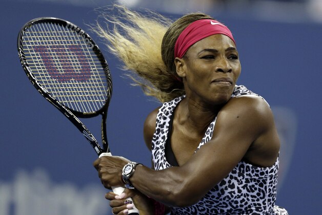 Serena Williams, of the United States, returns a shot to Flavia Pennetta, of Italy, during the quarterfinals of the U.S. Open tennis tournament Wednesday, Sept. 3, 2014, in New York. (AP Photo/Darron Cummings)
