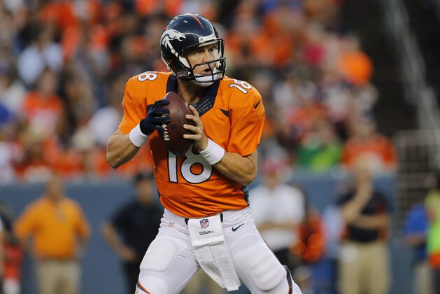 Denver Broncos quarterback Peyton Manning (18) throws against the Houston Texans during the first half of an NFL preseason football game, Saturday, Aug. 23, 2014, in Denver. (AP Photo/Joe Mahoney)