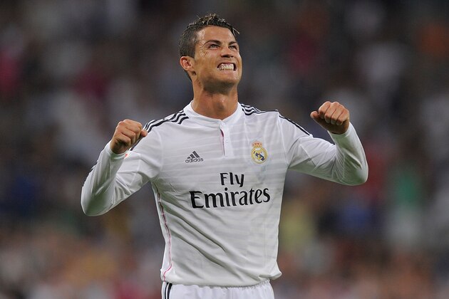 MADRID, SPAIN - AUGUST 25:  Cristiano Ronaldo of Real Madrid celebrates after scoring Real's 2nd goal during the La liga match between Real Madrid CF and Cordoba CF at Estadio Santiago Bernabeu on August 25, 2014 in Madrid, Spain.  (Photo by Denis Doyle/Getty Images)