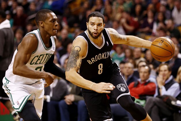 Jan 26, 2014; Boston, MA, USA; Brooklyn Nets point guard Deron Williams (8) drives to the hoop against Boston Celtics point guard Rajon Rondo (left) during the first half at TD Garden. Mandatory Credit: Mark L. Baer-USA TODAY Sports