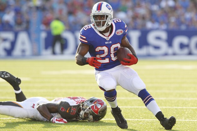 Tampa Bay Buccaneers cornerback Kip Edwards (39) dives to catch Buffalo Bills running back C.J. Spiller (28) during the second half of a preseason NFL football game Saturday, Aug. 23, 2014, in Orchard Park, N.Y. (AP Photo/Bill Wippert)