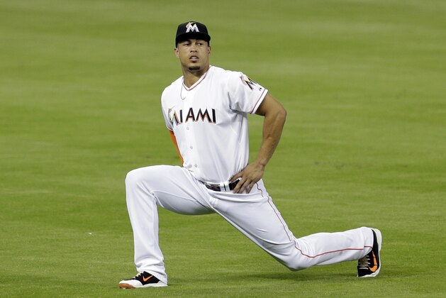 Miami Marlins right fielder Giancarlo Stanton warms up before a baseball game against the New York Mets in Miami, Wednesday, Sept. 3, 2014. (AP Photo/Alan Diaz)