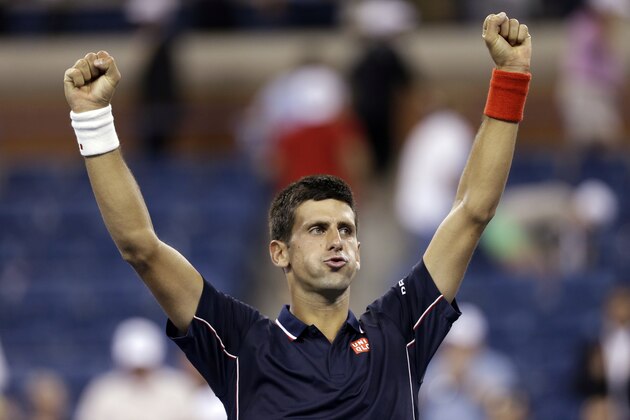 Novak Djokovic, of Serbia, celebrates after defeating Andy Murray, of Britain, 7-6 (1), 6-7 (1), 6-2, 6-4 in the quarterfinals of the U.S. Open tennis tournament Thursday, Sept. 4, 2014, in New York. (AP Photo/Darron Cummings)