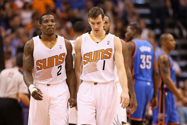 PHOENIX, AZ - APRIL 06:  (L-R) Eric Bledsoe #2 and Goran Dragic #1 of the Phoenix Suns during the NBA game against the Oklahoma City Thunder t US Airways Center on April 6, 2014 in Phoenix, Arizona. The Suns defeated the Thunder 122-115. NOTE TO USER: User expressly acknowledges and agrees that, by downloading and or using this photograph, User is consenting to the terms and conditions of the Getty Images License Agreement.  (Photo by Christian Petersen/Getty Images)